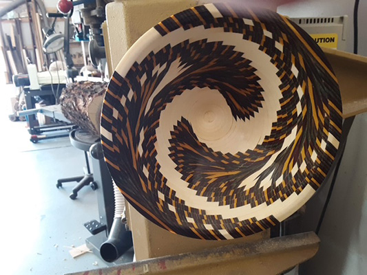 A bowl created in the Metlitzky style using hundreds of wood pieces
