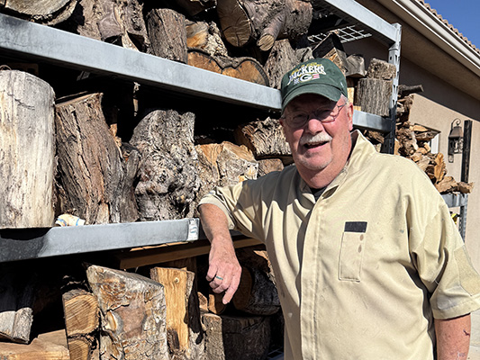 Gray keeps stacks of wood on hand for future project
