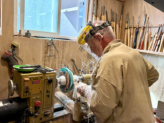 In his shop shaping epoxy edges