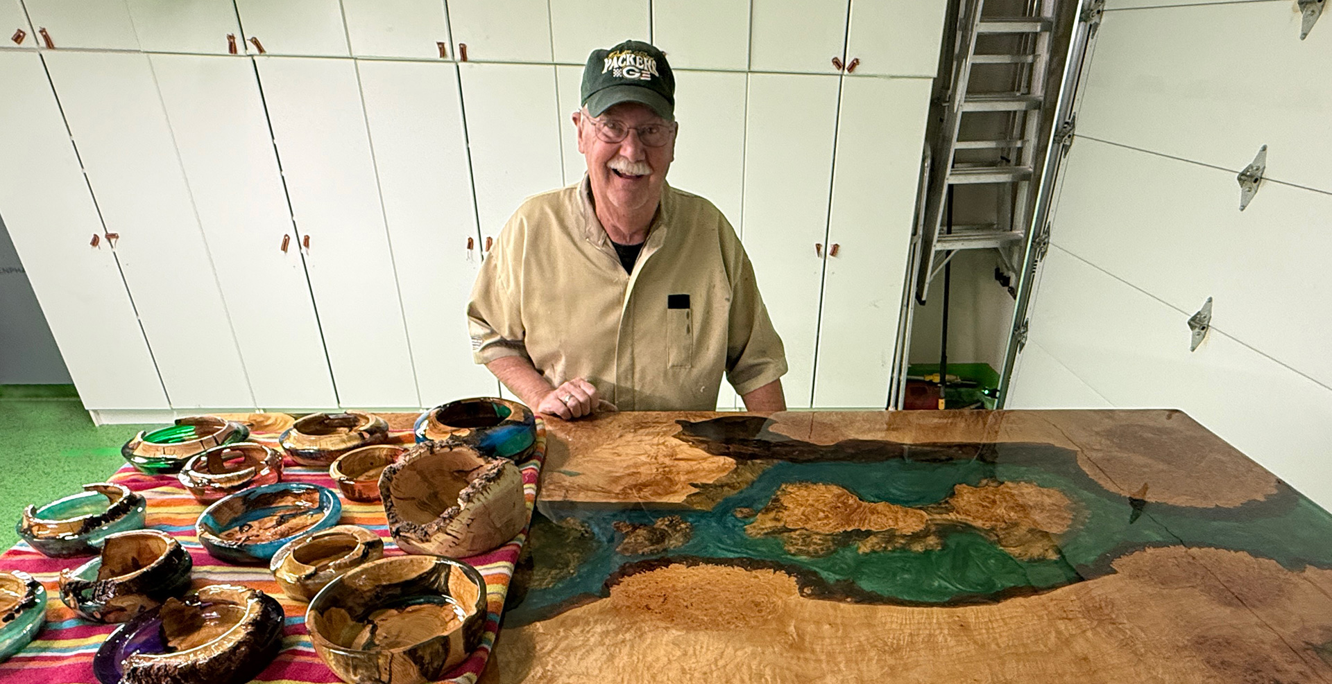 Recent work includes bowls and a large river table