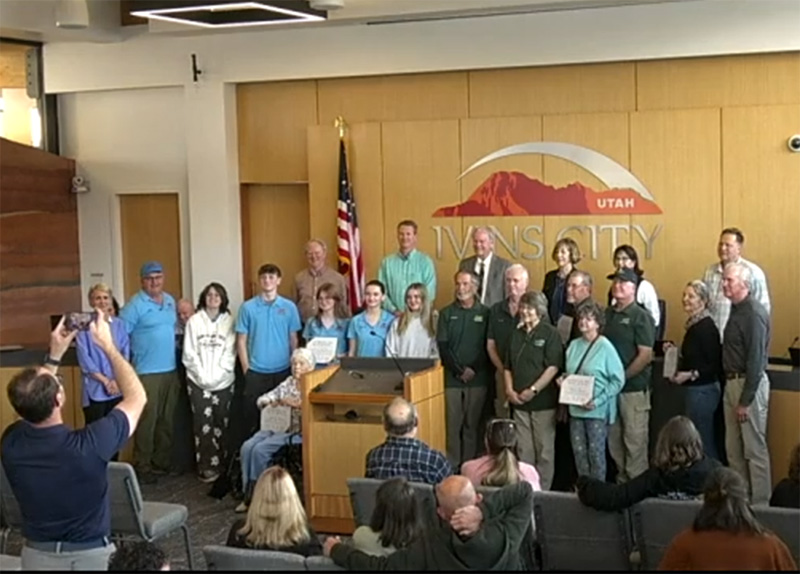 Sara Dupre and Dan Beck, front row, far right, represented DPI, along with Wayne Pennington, also honored for his work with the Community Emergency Response Team.